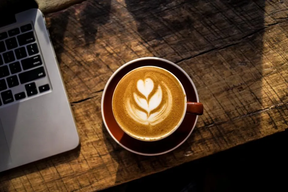 A latte on a wooden table
