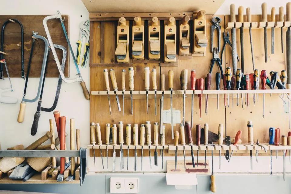 A workshop wall full of hand tools