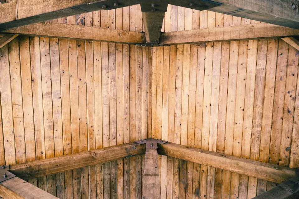 A wooden tongue and groove ceiling